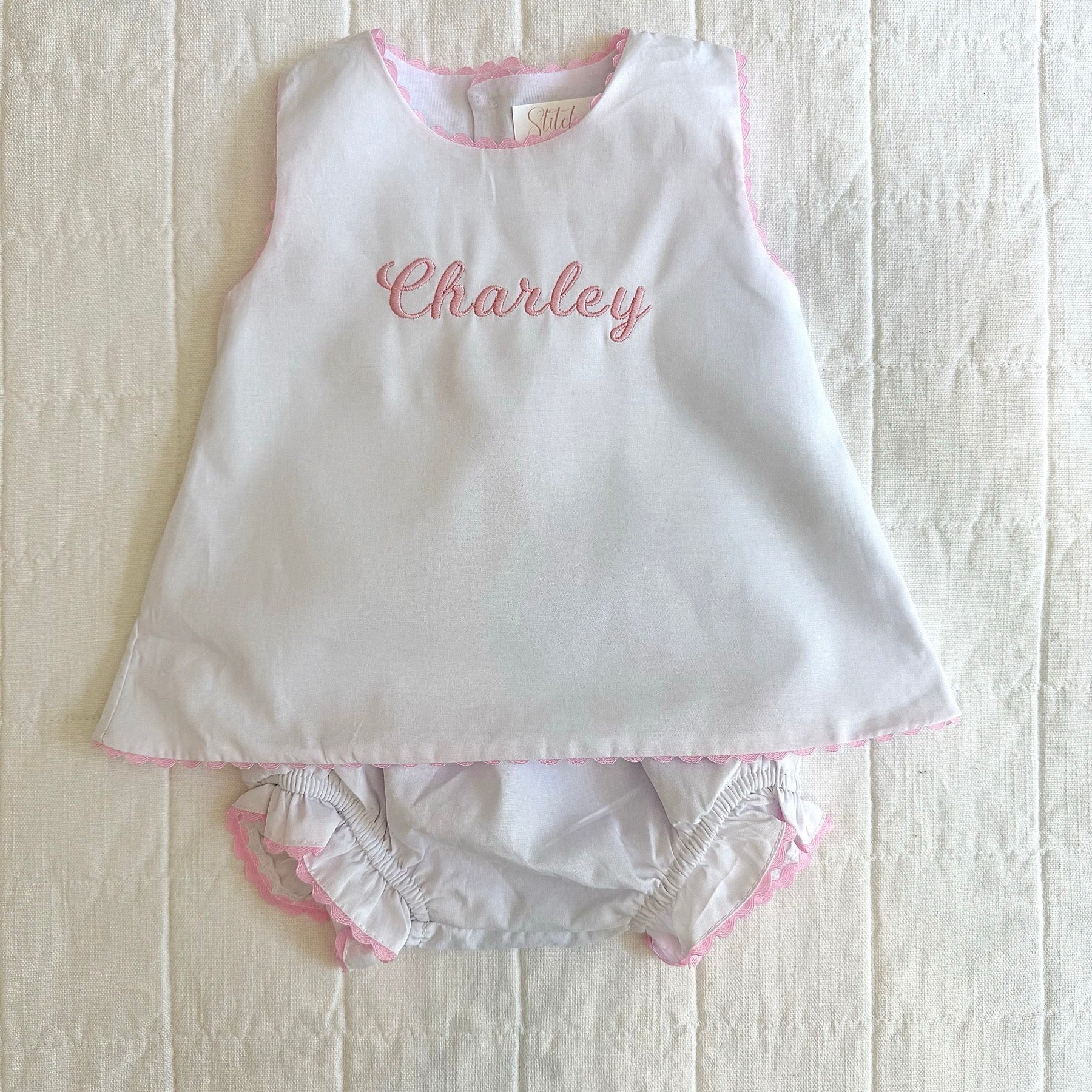 White and pink Charley embroidered baby outfit